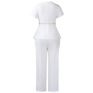Rear view of an elegant white two-piece peplum top and trousers set with gold chain belt