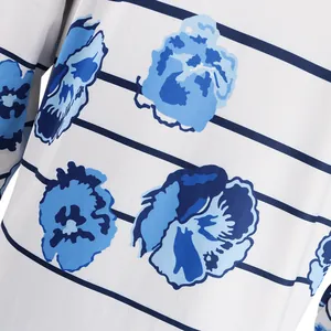 Detail view of blue floral and striped print on white long sleeve cardigan fabric.