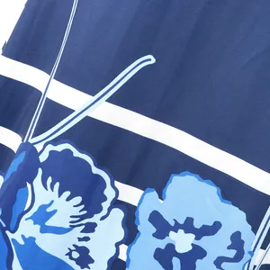 Macro view of blue floral and white striped print on lightweight clubwear fabric