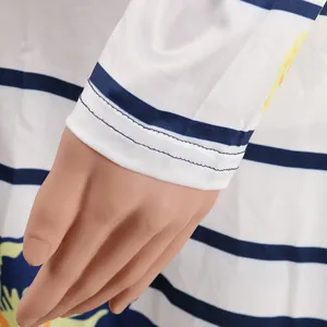 Close-up detail of the sleeve cuff on a striped floral print cardigan two-piece set