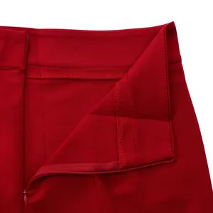 Detailed macro view of the red trousers waistband and high-quality concealed zipper stitching