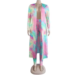 Close-up of vibrant tie-dye printed long cardigan and leggings two-piece outfit.