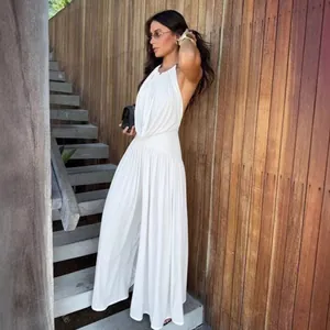 Elegant white halter V-neck pleated wide-leg jumpsuit set for a minimalist chic look