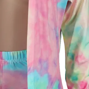 Macro detail of the colorful tie-dye print and precise stitching on a sexy two-piece set