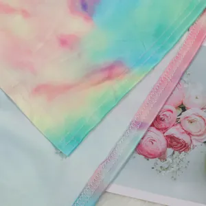 Close-up of high-quality stitching on the colorful tie-dye fabric of this nightclub suit