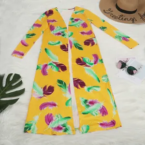Vibrant yellow long-sleeved cardigan featuring colorful feather prints and a resort style.