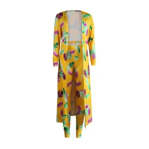 Vibrant yellow feather print two-piece set featuring long sleeve cardigan and matching pants