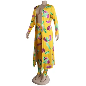Full view of this sexy yellow feather print two-piece set featuring a long cardigan