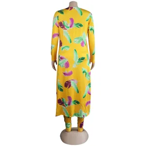 Back view of yellow two-piece set with vibrant feather print and long cardigan.