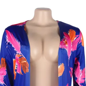 Detailed close-up view of a sexy blue nightclub cardigan featuring vibrant feather prints