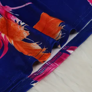 Macro view of floral print fabric hem showing neat stitching and quality craftsmanship