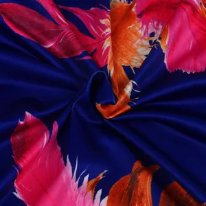 Close-up of vibrant feather print on soft fabric for a sexy two-piece nightclub outfit