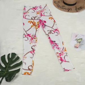 Floral and chain print leggings displayed with stylish summer holiday accessories