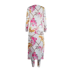 Back view of a white two-piece set featuring pink rose and golden chain baroque print