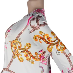 Detailed macro view of long sleeve women's cardigan featuring baroque floral and chain print