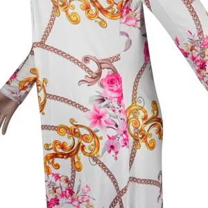 Detailed close-up showing the vibrant floral and golden chain print on white fabric