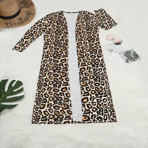 Detailed top view of leopard print long-sleeve cardigan on a white fur background