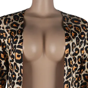 Close-up detail of the leopard print fabric and deep neckline on a sexy nightclub cardigan