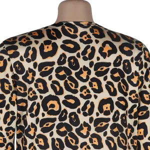 Close-up detail of leopard print fabric on a stylish long-sleeve cardigan