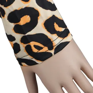 Macro detail of sexy leopard print garment cuff showing stitching and fabric texture