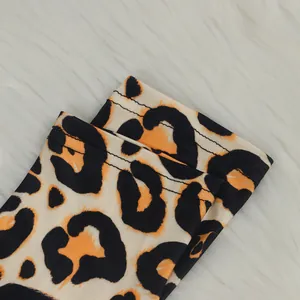 Detail shot of leopard print garment cuff featuring high-quality double-needle stitching