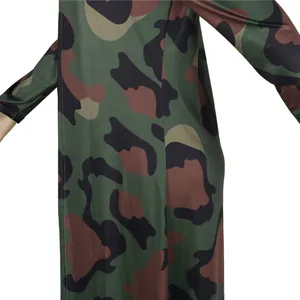 Macro detail shot of the vibrant camouflage print on long-sleeved nightwear fabric.