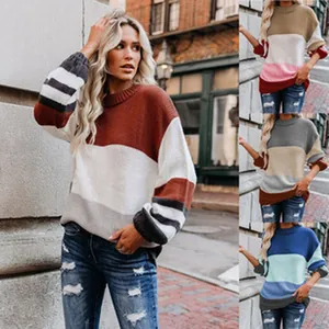 Detailed look at women's stylish color-block oversized knit pullover in multiple shades.