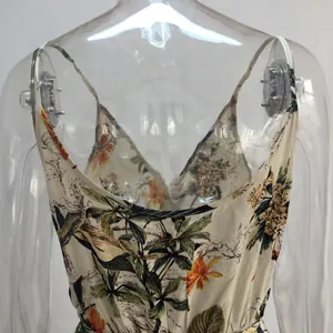 Close-up of floral print jumpsuit with V-neck and spaghetti straps