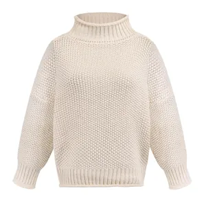 Detailed view of a premium white chunky knit turtleneck sweater with ribbed cuffs