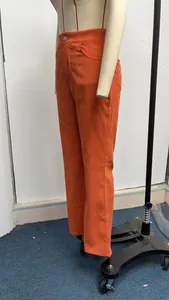 Detailed side view of orange corduroy high waist flare pants displayed on a mannequin