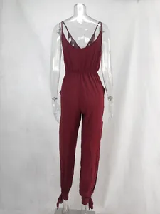 Back view detail of a wine red camisole jumpsuit featuring V-neck and tied leg cuffs