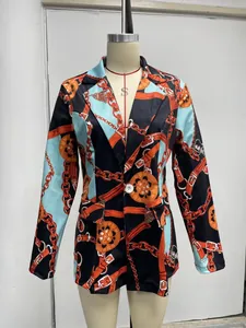 Detailed view showing the vibrant chain and belt buckle print on this elegant women's blazer