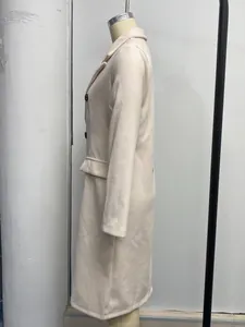 Side view of elegant cream double-breasted long wool coat on a mannequin.