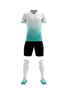 Detailed product view of a gradient white and teal soccer kit with jersey and shorts