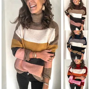 Close-up detail of women's vibrant color block striped turtleneck knit sweaters