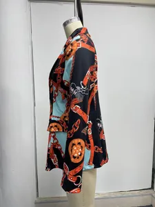 Side detail of a women's patterned blazer with elegant chain and belt print motifs.