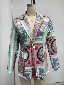 Detail of a colorful women's blazer featuring vibrant baroque patterns and lapels.
