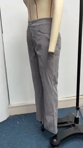 Side view of high-waisted grey corduroy flare pants on a mannequin detail display