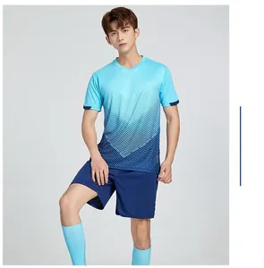 Male model wearing a blue gradient quick-dry soccer jersey and shorts for sports