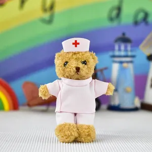 Detailed view of a cute nurse teddy bear plush doll in a pink uniform and hat