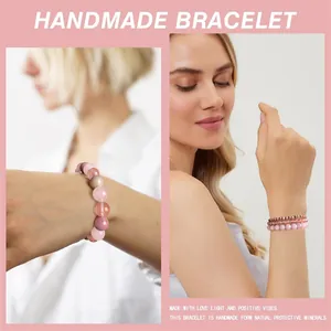 Detail view of pink natural stone and wood grain crystal beaded bracelet set on model's wrist