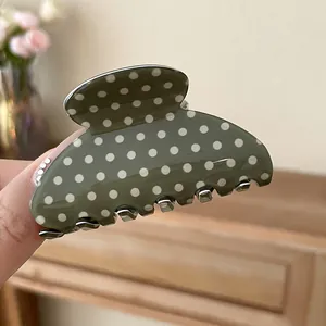 Elegant olive green acrylic hair claw clip with white polka dots for women's hairstyle