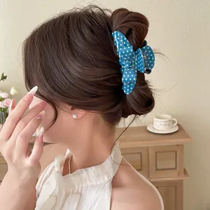 Elegant blue polka dot bow hair claw clip for stylish women's bun hairstyle accessory