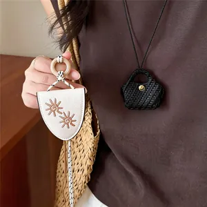 Detailed view of stylish retro leather eyeglass holder necklaces worn by a model