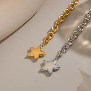 Close-up detail of gold and silver star pendants on polished stainless steel link chains