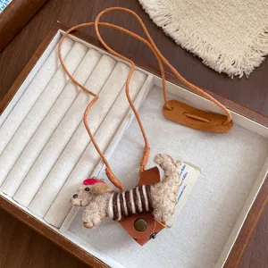 Close-up of a cute flocked dog eyeglass holder necklace with a brown leather cord and strap
