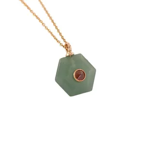 Hexagonal green natural stone pendant necklace with red gem accent on gold chain.