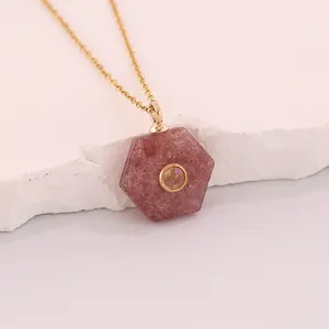 Close-up of hexagonal reddish natural stone pendant with gold stainless steel chain