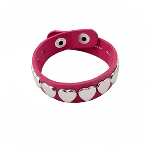 Fashionable pink leather bracelet with silver heart metal studs for a sweet cool look