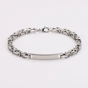 Macro view of stainless steel Byzantine chain bracelet with smooth engraving plate